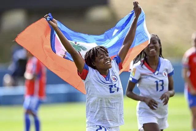 Ruthny Mathurin of Haiti celebrates victory during the 2023 FIFA World Cup Play Off Tournament match between Chile and Haiti at North Harbour Stadium on February 22, 2023 in Auckland, New Zealand. (Photo by Andrew Cornaga/Photosport via AP Photo)