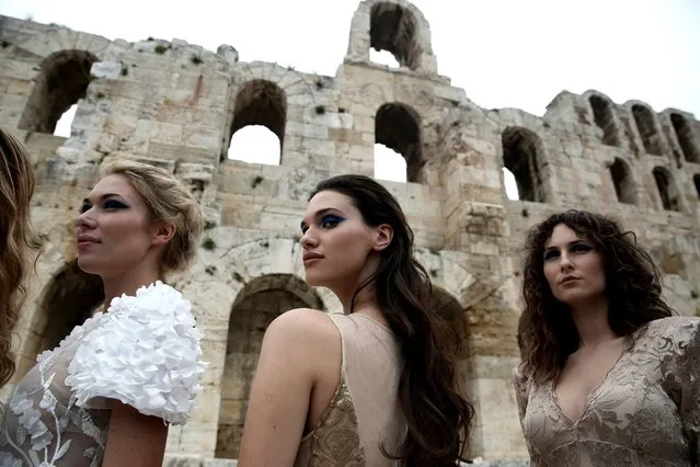 Models present creations by Greek designer Vassilios Kostetsos, who presented his Spring-Summer collection “Narcissus” during a fashion show that took place at the entrance of the ancient Odeon of Herodes Atticus in Athens, Greece, 31 March 2018, as part of the Athens Xclusive Designers Week. (Photo by Simela Pantzartzi/EPA/EFE)