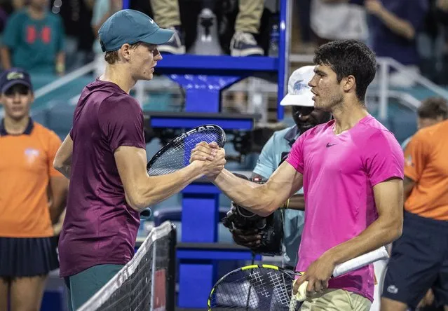 Jannik Sinner of Italy (L) shakes hands with Carlos Alcaraz of Spain after his victory during the Men's Singles Semifinals of the 2023 Miami Open tennis tournament at the Hard Rock Stadium in Miami, Florida, USA, 30 March 2023. (Photo by Cristobal Herrera-Ulashkevich/EPA)