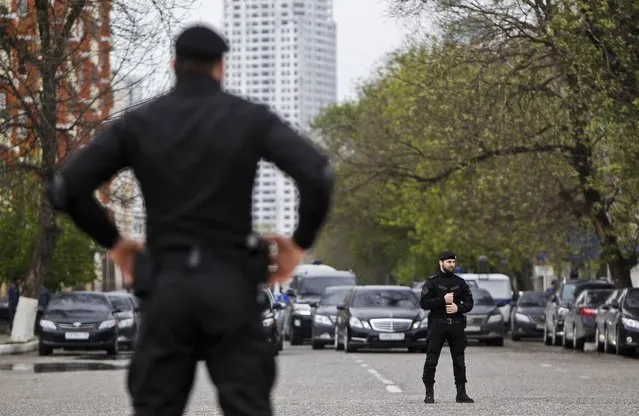 Special forces officers stand guard during a government-organised event marking Chechen language day in the centre of the Chechen capital Grozny April 25, 2013. (Photo by Maxim Shemetov/Reuters)