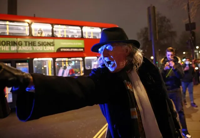 An anti-lockdown protester gestures during a demonstration and a New Year's celebration, amid the outbreak of the coronavirus disease (COVID-19), in London, Britain on January 1, 2021. (Photo by Henry Nicholls/Reuters)