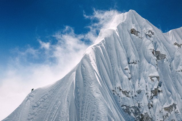 In this handout photograph taken on October 15, 2025, a French mountaineer makes his way near the summit of Jannu East, the first ascent of the 7,468 m peak in eastern Nepal. Nepal's mountains including Everest have long drawn climbers from across the world, but a growing community is exploring hidden summits promising solitude and the chance to be first to the top. The Himalayan nation is home to eight of the world's 10 highest peaks and welcomes hundreds of climbers every year, making mountaineering a lucrative business. (Photo by Thibaut Marot/AFP Photo)