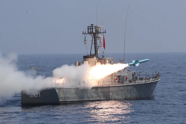 A handout photo made available by the Iranian Army Office shows a missile being fired from an Iranian Navy warship (Sina-class fast attack craft P235) during a navy military drill in the Gulf of Oman, 14 January 2021. Following tensions between Iran and US, Iran begin a short-range missile drill in the Gulf of Oman and inaugurated its local-made warship. (Photo by Iranian Army Office/EPA/EFE)