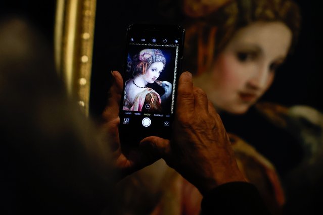A visitor takes a picture of the artwork titled “Leda” by Michele di Ridolfo del Ghirlandaio displayed at Jacquemart-Andre Museum, in Paris, France, 05 September 2024. The exhibition of masterpieces from the Galleria Borghese (Chefs-d'œuvre de la Galleria Borghese) runs in Jacquemart-Andre Museum from 06 September 2024 to 05 January 2025. (Photo by Mohammed Badra/EPA/EFE)
