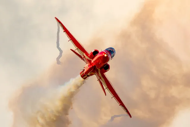 The picture dated March 30, 2023 shows the iconic Red Arrows rehearsing in the skies over RAF Scampton in Lincolnshire, UK. The planes made the most of a break in the wet weather to practise their manoeuvres in preparation for this year's spectacular airshows. (Photo by Claire Hartley/Bav Media)