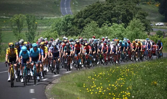The pack rides during the second stage of the 75th edition of the Criterium du Dauphine cycling race, 167,3 kms betwenn Brassac-les-Mines and La Chaise-Dieu, central France, on June 5, 2023. (Photo by Anne-Christine Poujoulat/AFP Photo)