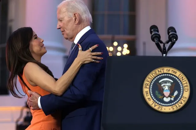 U.S. President Joe Biden hugs film director Eva Longoria during a screening of the film “Flamin’ Hot” on the South Lawn of the White House on June 15, 2023 in Washington, DC. The movie tells the story of Richard Montanez, a janitor at Frito-Lay who claimed to have created the recipe for Flamin’ Hot Cheetos, which turned the snack into a global phenomenon. (Photo by Alex Wong/Getty Images)