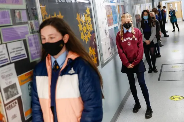 Students queue to take lateral flow tests at Weaverham High School, as the coronavirus disease (COVID-19) lockdown begins to ease, in Cheshire, Britain, March 9, 2021. (Photo by Jason Cairnduff/Reuters)
