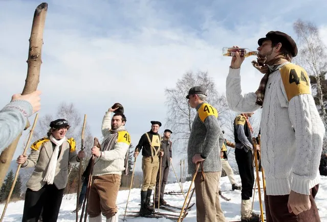Participants wearing vintage dresses prepare for a traditional historical ski race in the northern Bohemian town of Smrzovka February 21, 2015. (Photo by David W. Cerny/Reuters)