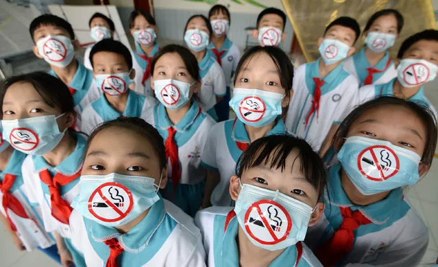 On May 28th, 2021 Chunguang Primary School in Congtai District, Handan City, Hebei Province launched the theme activity “To be a young guard against smoking cessation”, calling on people to stay away from tobacco and promote a healthy lifestyle through non-smoking sign masks, non-smoking handwritten newspapers, and non-smoking performance art, to create a smoke-free growth environment for children to welcome the arrival of “World No Tobacco Day”. (Photo by Sipa Asia/Rex Features/Shutterstock)