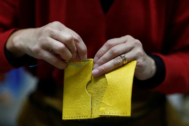 Hunter Fujiko Nagata stitches a purse made of deer skin at her workshop in Hakusan, Ishikawa Prefecture, Japan, November 19, 2016. (Photo by Thomas Peter/Reuters)