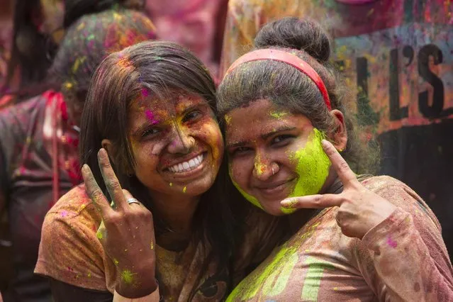 Malaysian-Indian women pose for a photo during the religious spring festival Holi in Kuala Lumpur, Malaysia on Saturday, March 21, 2015. (Photo by Joshua Paul/AP Photo)