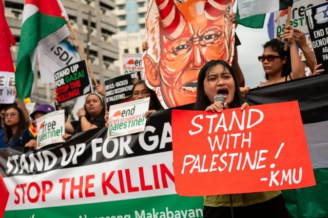 Filipino protesters hold a demonstration condemning the blast at Al-Ahli hospital in Gaza that Israeli and Palestinian officials blamed on each other, in Quezon City, Philippines on October 18, 2023. (Photo by Reuters/Stringer)