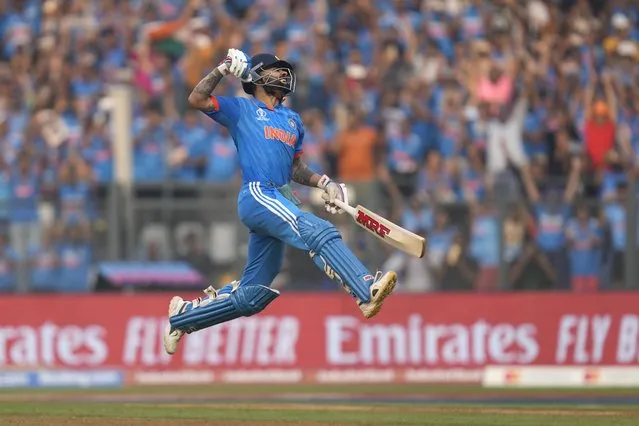 India's Virat Kohli celebrates his century during the ICC Men's Cricket World Cup first semifinal match between India and New Zealand in Mumbai, India, Wednesday, November 15, 2023. Kohli hit his record 50th century in one-day internationals at the Cricket World Cup on Wednesday, surpassing the mark he shared with countryman Sachin Tendulkar. (Photo by Rafiq Maqbool/AP Photo)