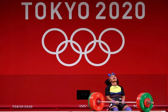 Ecuador's Neisi Patricia Dajomes Barrera reacts as she competes in the women's 76kg weightlifting competition during the Tokyo 2020 Olympic Games at the Tokyo International Forum in Tokyo on August 1, 2021. (Photo by Edgard Garrido/Reuters)