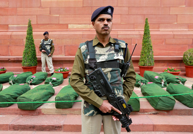 Armed policemen stand guard next to bags containing budget papers inside the parliament premises in New Delhi, India, February 1, 2019. (Photo by Adnan Abidi/Reuters)
