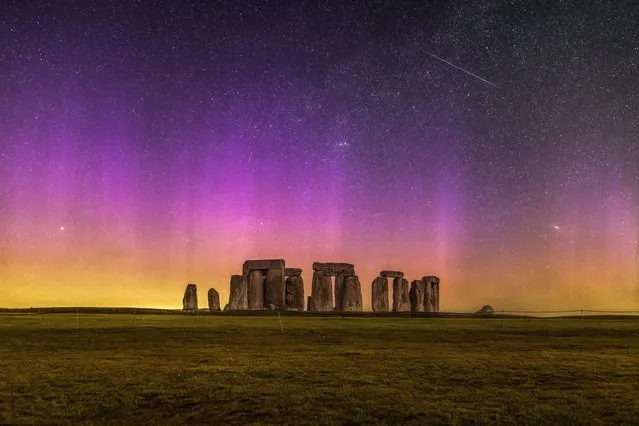The aurora borealis and a Lyrid meteor created an astonishing light show over Stonehenge, Wiltshire, early on Monday, April 24, 2023. (Photo by Nick Bull/Picture Exclusive for The Times)