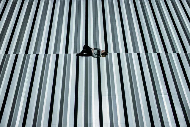 A person lies in an artwork called Test patterns No 9 designed by Japanese artist Ryoji Ikeda, on March 1, 2016 in the Confluence museum in Lyon. (Photo by Jeff Pachoud/AFP Photo)