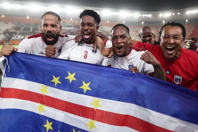 Cape Verde's players celebrate with Cape Verde's head coach Pedro Leitao Brito (R) after the victory at the end of the Africa Cup of Nations (CAN) 2024 round of 16 football match between Cape Verde and Mauritania at the Felix Houphouet-Boigny Stadium in Abidjan on January 29, 2024. (Photo by Franck Fife/AFP Photo)