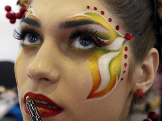 A model prepares backstage during the “Ideal of Beauty” festival and exhibition in Russia's Siberian city of Krasnoyarsk, April 25, 2015. (Photo by Ilya Naymushin/Reuters)