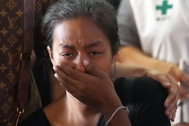 A relative of a victim by an explosion at a firework factory cries at Rong Chang temple in Suphan Buri province, Thailand, Thursday, January 18, 2024. The blast in central Thailand killed multiple people on Wednesday, according to provincial officials, though the devastation at the scene has made the death toll uncertain. (Phoot by Sakchai Lalit/AP Photo)