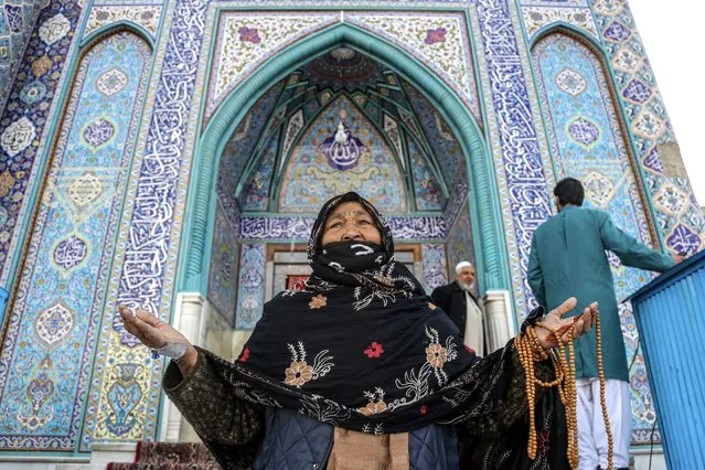 An Afghan woman visits the Shrine of Saint Sakhi Saib to celebrate Nowruz, the Persian New Year, in Kabul, Afghanistan, 20 March 2024. Nowruz, which this year falls on 20 March has been celebrated for at least three thousand years, is the most revered celebration in the greater Persian world, which includes the countries of Iran, Afghanistan, Azerbaijan, Turkey, and portions of western China and northern Iraq. (Photo by Samiullah Popal/EPA)