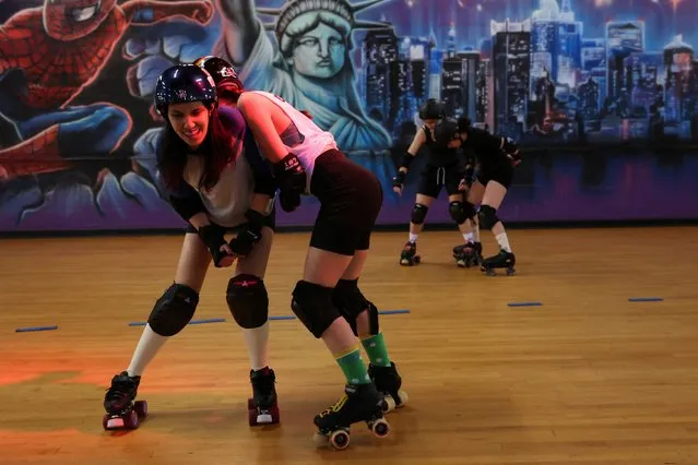 Members of New York's Long Island Roller Rebels practice drills at the United Skates of America Roller Skating facility in Massapequa, New York, U.S., on March 19, 2024. (Photo by Shannon Stapleton/Reuters)