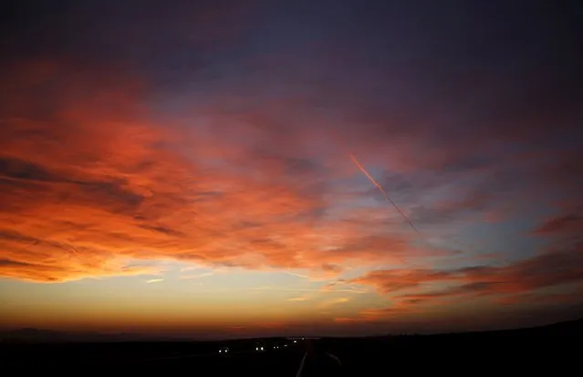 Vehicles are seen on a highway as the sun sets near the city of Stara Zagora, Bulgaria, February 3, 2016. (Photo by Stoyan Nenov/Reuters)