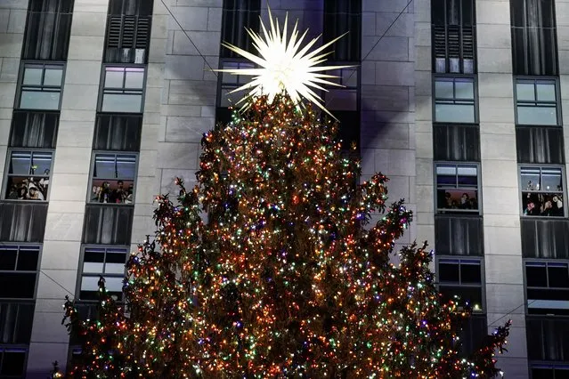The Rockefeller Center Christmas tree stands lit at Rockefeller Center during the 89th annual Rockefeller Center Christmas tree lighting ceremony, Wednesday, December 1, 2021, in New York. (Photo by John Minchillo/AP Photo)
