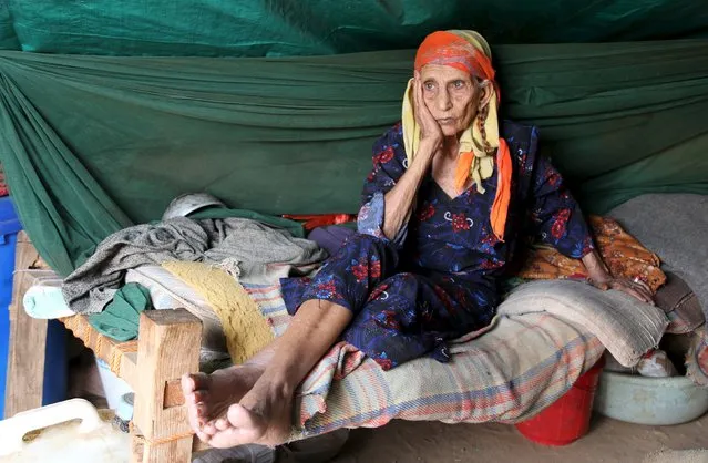 A woman sits in her hut at the Shawqaba camp for internally displaced people who were forced to leave their villages by the war in Yemen's northwestern province of Hajjah March 12, 2016. (Photo by Abduljabbar Zeyad/Reuters)