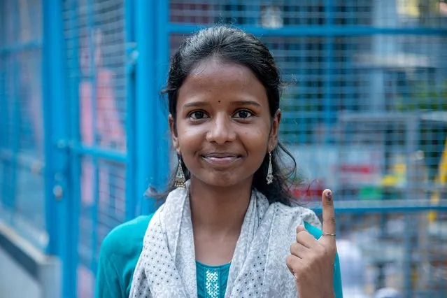 First time voter Visaalini, 19, shows her inked finger after casting her vote for the first phase of general elections at a polling station in Chennai, India, 19 April 2024. The Indian general elections will be held over seven phases between 19 April and 01 June 2024 with the results being announced on 04 June for the 545-member lower house of parliament, or Lok Sabha. The elections are held every five years in which about 968 million people are eligible to vote. (Photo by Ragul Krishnan/EPA)
