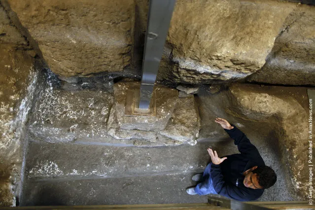 Israeli Archaeologist Eli Shukron of the Israel Antiquities Authority speaks inside a ritual bath exposed beneath the Western Wall in Jerusalem's Old City, Israel