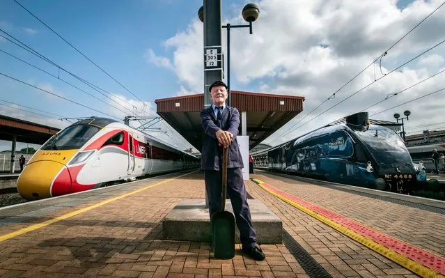 Steam traction inspector Jim Smith is pictured with a new Azuma train standing alongside the Mallard steam locomotive at York Station, Yorkshire on July 30, 2019, as London North East Railway's new Azuma service is launched. (Photo by Danny Lawson/PA Images via Getty Images)