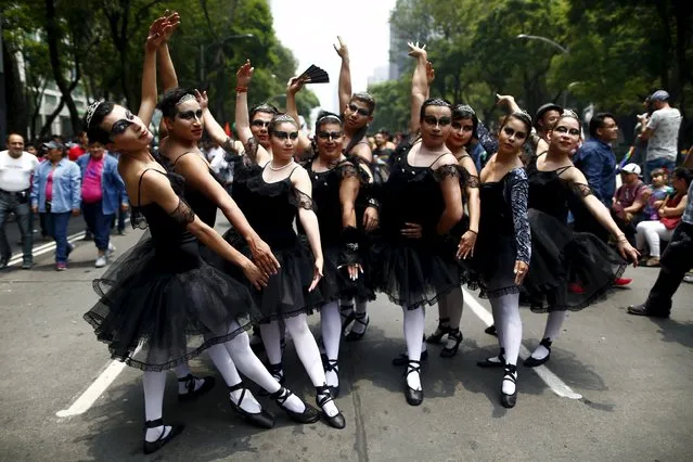 Participants gesture as they march during a Gay Pride Parade in Mexico City, June 27, 2015. (Photo by Edgard Garrido/Reuters)