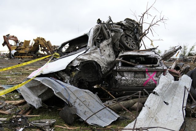 Damaged cars sit piled up next to a road after a tornado Tuesday, May 21, 2024, in Greenfield, Iowa. (Photo by Charlie Neibergall/AP Photo)