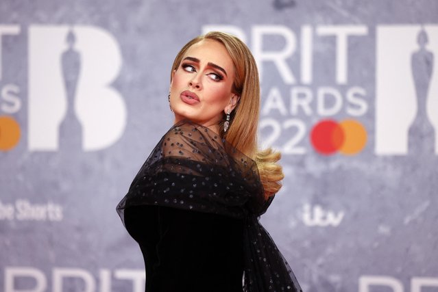 English singer-songwriter Adele poses as she arrives for the Brit Awards at the O2 Arena in London, Britain, February 8, 2022. (Photo by Tom Nicholson/Reuters)