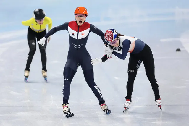 Suzanne Schulting of Team Netherlands and Minjeong Choi of Team South Korea compete as they cross the finish line during the Women's 1000m Final A on day seven of the Beijing 2022 Winter Olympic Games at Capital Indoor Stadium on February 11, 2022 in Beijing, China. (Photo by Matthew Stockman/Getty Images)