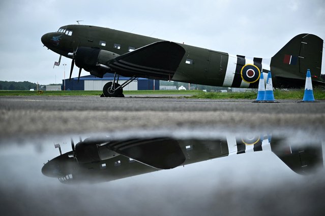 A photograph taken on May 16, 2024, shows the C-47 Dakota aircraft displayed on the tarmac at North Weald Airfield, in Epping, Essex, west England, prior to be taken to Normandy ahead of the celebrations of the 80th anniversary of D-Day. (Photo by Ben Stansall/AFP Photo)