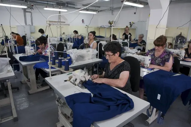 Employees of a garment factory work in Tskhinvali, the capital of the breakaway region of South Ossetia, Georgia, July 6, 2015. (Photo by Kazbek Basaev/Reuters)