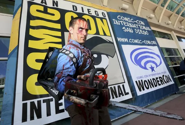 An attendee dressed in cosplay as the character Ash from the movie “The Evil Dead” poses outside the 2015 Comic-Con International in San Diego, California July 8, 2015. (Photo by Sandy Huffaker/Reuters)