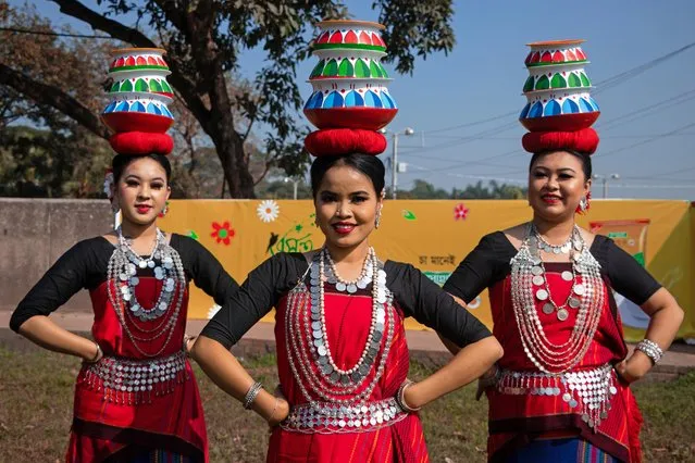 Women and children wearing traditional dresses with floral ornaments perform during “Basanta Utsab” (Spring Festival), also called “Pohela Falgun”, the first day of Spring of the Bengali month “Falgun”, in Dhaka, Bangladesh on February 14, 2022. The blazing red and yellow are the representative colours of “Pohela Falgun”. Hundreds of people take part in the cultural ceremony to welcome the first day of “Basanta” (Spring), known as the symbol of life, and begins with the first day of the Bengali month of “Falgun”. (Photo by Joy Saha/ZUMA Press Wire/Rex Features/Shutterstock)