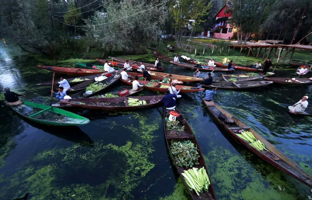 Vegetable vendors assemble at a floating market in the interior of Dal lake during restrictions after scrapping of the special constitutional status for Kashmir by the Indian government, in Srinagar, September 5, 2019. (Photo by Danish Ismail/Reuters)
