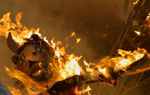 A puppet burns on Saint Walpurga's Eve, a tradition said to “ward off evil spirits and witches”, in Grossharthau, Germany on April 30, 2023. (Photo by Matthias Rietschel/Reuters)