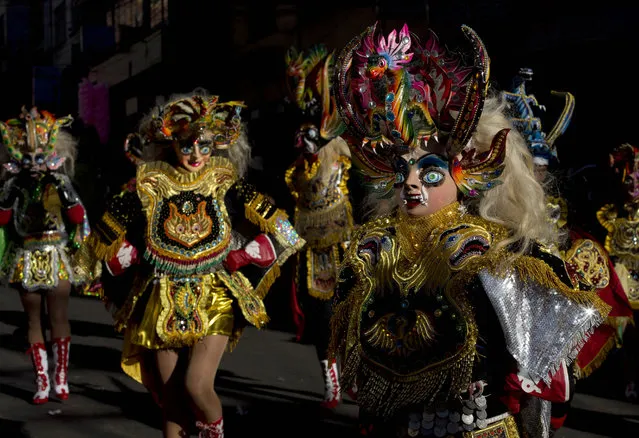 Women dressed as the she devil La China Supay, perform in the traditional “Diablada” dance during the inaugural parade for the religious celebration, “The Lord of Great Power”, honoring Christ as the second person of the Holy Trinity, in La Paz, Bolivia, Saturday, May 21, 2016. (Photo by Juan Karita/AP Photo)