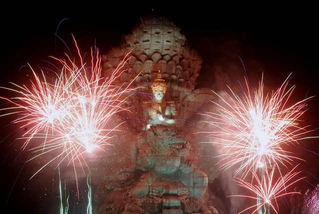 Fireworks explode over Garuda Wisnu Kencana statue during New Year's celebrations in Bali, Indonesia on January 1, 2020. (Photo by Fikri Yusuf/Antara Foto via Reuters)