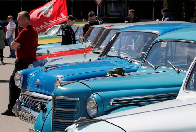 Participants attend a gathering of Soviet-era Moskvich cars owners and enthusiasts in Moscow, Russia on May 21, 2022. (Photo by Shamil Zhumatov/Reuters)