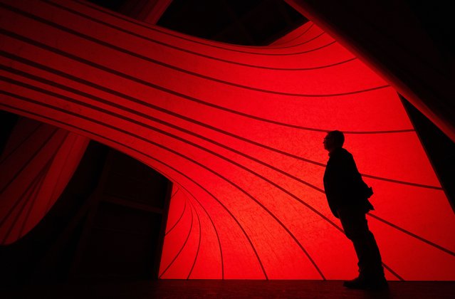 A person stands in “Sectional Body Preparing for Monadic Singularity” by British artist Anish Kapoor during a media preview for the exhibition 'Monadic Singularity' in Liverpool Cathedral, 09 August 2024. The British sculptor's exhibition forms part of Liverpool Cathedral's centenary celebrations and features a large installation in the Well, a wax sculpture in the Main Space, and a work in the Lady Chapel. The exhibition runs from 10 August to 15 September and is Kapoor's first solo show in a British Cathedral. (Photo by Adam Vaughan/EPA)