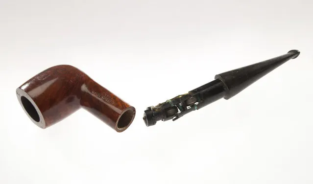 A subminiature radio receiver is concealed in this modified pipe. The user hears the sound via “bone conduction” from the jaw to the ear canal. (Photo by Central Intelligence Agency)