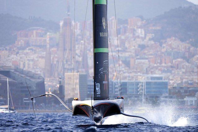 Ineos Britannia races against Emirates Team New Zealand during the Louis Vuitton 37th America's Cup Day 4 race 6 in Barcelona, Spain, Wednesday, October 16, 2024. (Photo by Bernat Armangue/AP Photo)