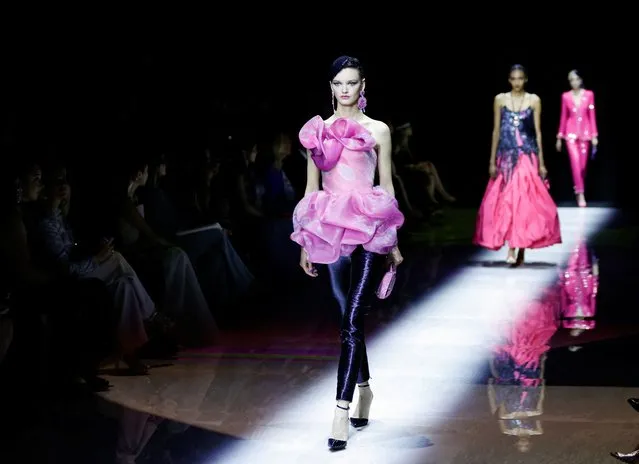 Models present a creation by designer Giorgio Armani as part of his Haute Couture Fall/Winter 2022-2023 collection show for fashion house Giorgio Armani Prive in Paris, France on July 5, 2022. (Photo by Johanna Geron/Reuters)